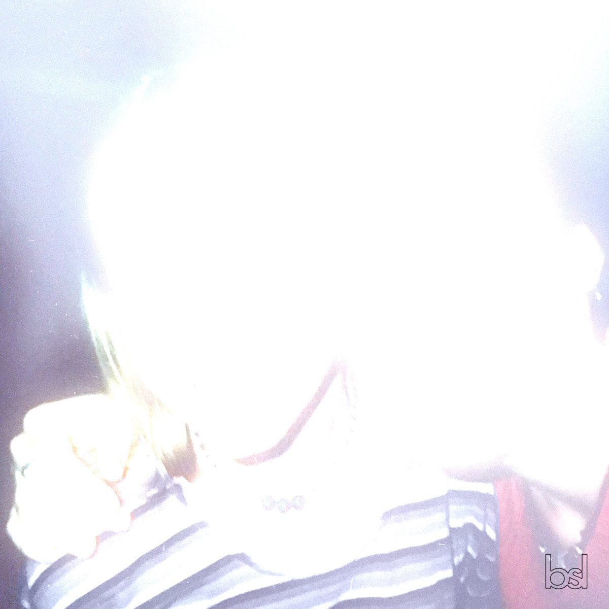 Blissed cover: an overexposed direct-flash snapshot, almost white, of someone in a striped top